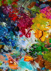 Artist's palette with oil paints. Multicolor abstract background. Oil paints on the palette  