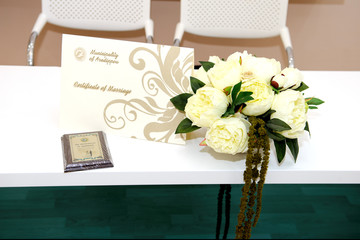 official certificate of marriage on white table