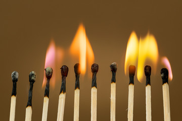 Match sticks burning with a bright colorful flames