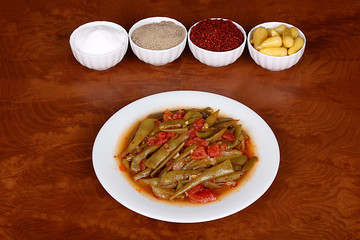 excellent turkish food green beans on a spicy white plate
