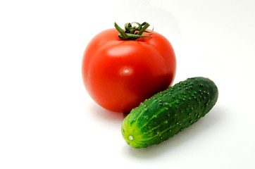 Red tomato and cucumber photo on a white background