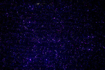 background of shiny dark blue christmas tinsel