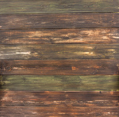 old wooden painted wall with cracked and sometimes peeling paint