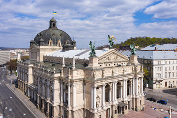Sculpture of fame with palm branch on Lviv opera house, Ukraine from drone