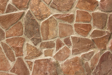 concrete wall with large fragments of broken stone