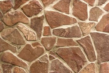 concrete wall with large fragments of broken stone