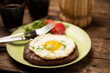 Hamburger with fried egg closeup