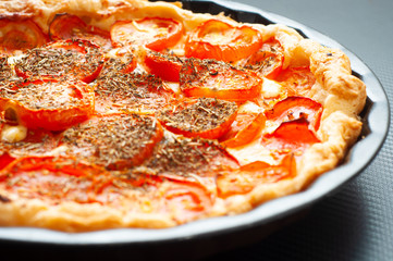 French tomato and mustard tart, baked in puff pastry and seasoned with herbs de provence. A tasty alternative to pizza.