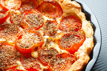French tomato and mustard tart, baked in puff pastry and seasoned with herbs de provence. A tasty alternative to pizza.