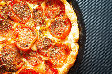 French tomato and mustard tart, baked in puff pastry and seasoned with herbs de provence. A tasty alternative to pizza.