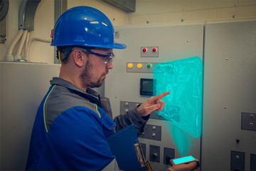 New technology for equipment quality control: energy engineer diagnoses electrical switchboards in an electrical panel using new technologies