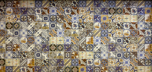 wall of multicolored tiles with ethnic patterns pottery retro