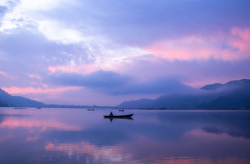 Fishing: Many fisherman/woman doing their job early morning in Fewa Lake , Pokhara 