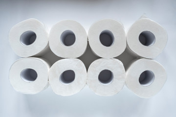 Toilet paper rolls on white backgorund. Hygiene concept. White paper texture. Household concept.