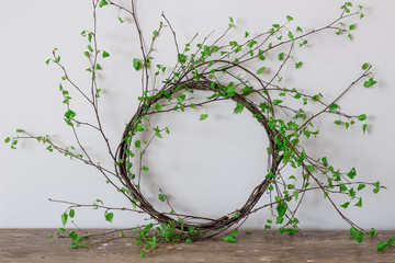 Wreath made from green birch tree branches as a home decor