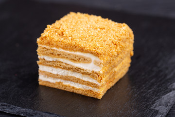 Cake honey with cream, nuts and honey crumb