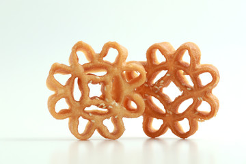 Honeycomb cookies also known as Kuih Loyang on white background. This cookie is popular during the...