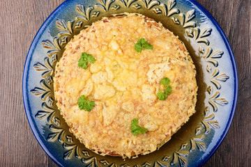 Top view. Turkish berek with cheese on a blue dish.