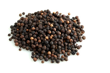Pile of black peppercorns isolated on white