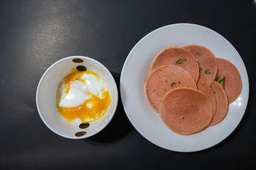 A hard-boiled egg is served with fresh chili borona for an important breakfast.