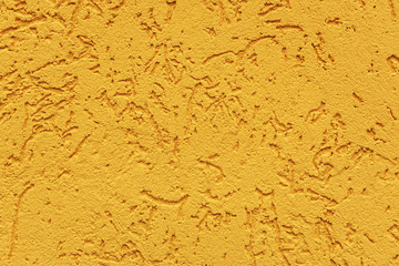 orange cement wall, building facade as a color relief texture close-up, copy space