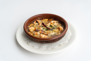 Shrimp Pil Pil with olive oil and garlic cooked in a clay pot dish