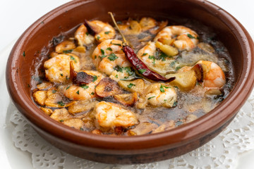 Shrimp Pil Pil with olive oil and garlic cooked in a clay pot dish