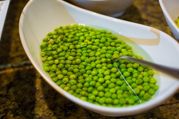 Green peas on the spoon