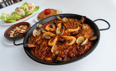 Spanish food together in one shot, paella, Tortilla espanola, Gambas Pil Pil, Ensalada de Pescado