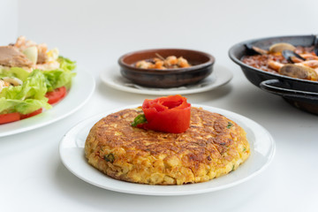 Spanish food together in one shot, paella, Tortilla espanola, Gambas Pil Pil, Ensalada de Pescado