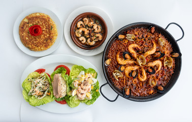 Spanish food together in one shot, paella, Tortilla espanola, Gambas Pil Pil, Ensalada de Pescado