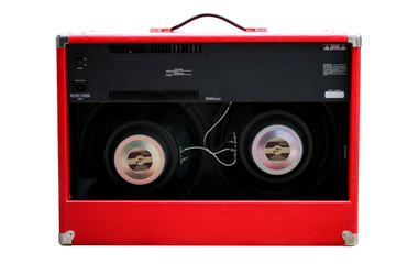 Fototapeta premium Isolated red vintage amplifier on white background with work path. back panel view.