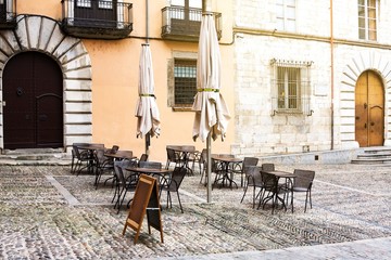 Empty street cafe near catheral in Girona, province Barcelona