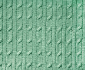 Green knitted fabric background texture