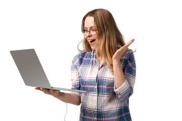 Young caucasian woman using laptop, devices, gadgets isolated on white studio background. Concept...