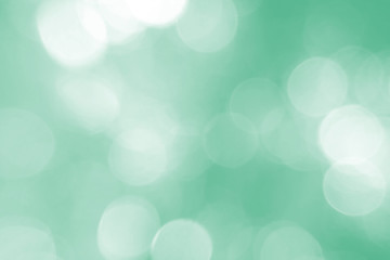 Fototapeta premium Defocused abstract background green lights. The theme of ecology, healthy lifestyle. Medicine, science, technology. Rod designer abstraction for writing of the text. Backdrop, effect, texture.