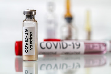 Conceptual image. Vaccine bottle to protect from Covid-19. Healthcare and medical concept. Closeup