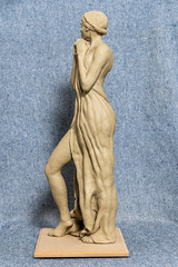 Gypsum sculpture of an unknown girl. The girl stands
