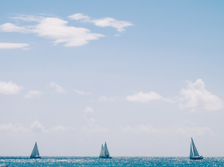Three boats at the open sea at sunny day