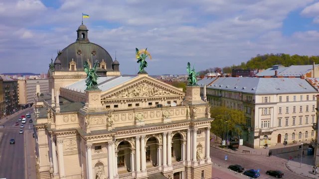 Sculpture of fame with palm branch on Lviv opera house, Ukraine from drone
