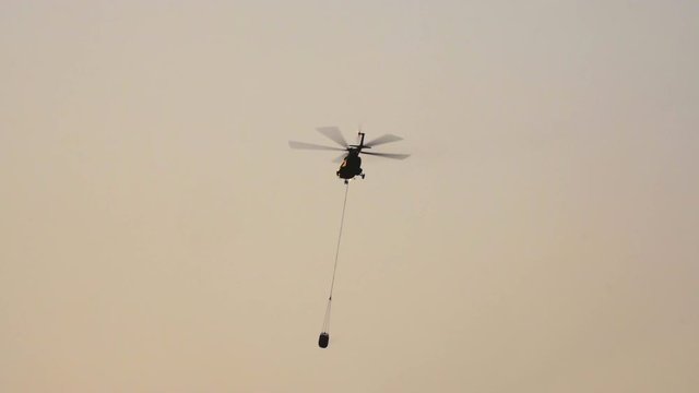 Mi-17 Helicopter carry water bucket for forest fire
