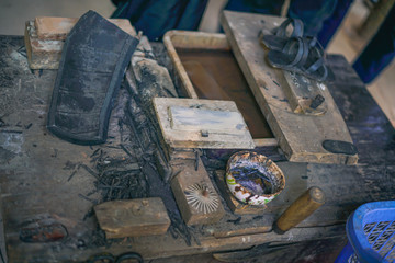 Showcase of smart sandals worn during Vietnam War in Cu Chi tunnels, Ho Chi Minh city, Vietnam