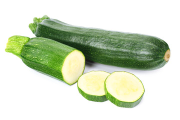 fresh green zucchini with slices isolated on white background.