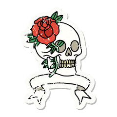 grunge sticker with banner of a skull and rose