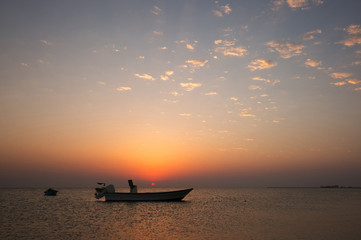 Fototapeta na wymiar Speed boats during sunset at Busaiteen coast, Bahrain