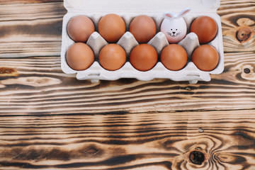 Top view of 9 Easter eggs and 1 bunny ears egg. Easter bunny.