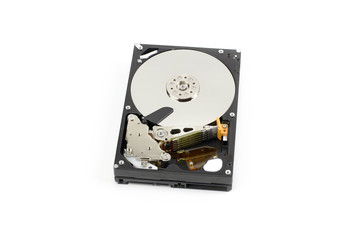 Inside a hard drive with a data plate and a needle for reading and writing data,on white isolated background.