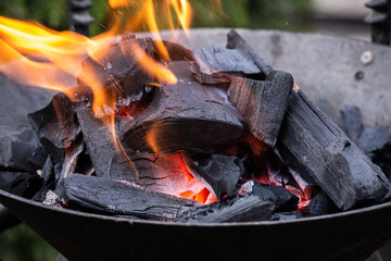 Fire burning in a fireplace. Charcoal and BBQ season.