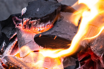 Fire burning in a fireplace. Charcoal and BBQ season.