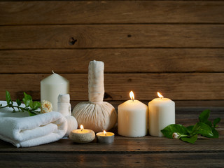 Spa set with alight candles.